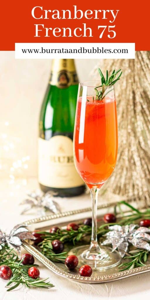 A cranberry French 75 on a silver platter with Christmas decor around it and a bottled of Champagne in the background with text overlay on top.