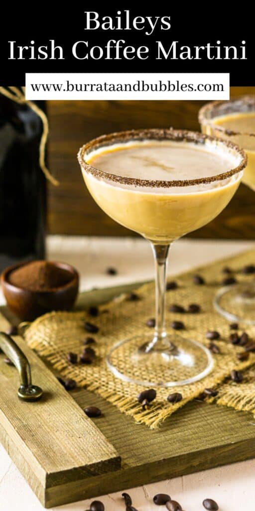 A Baileys Irish coffee martini on a wooden tray with burlap and coffee beans scattered around it with text overlay on top of the image.