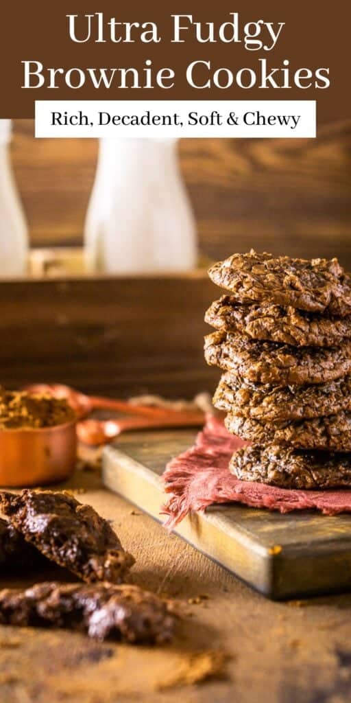 A stack of brownie cookies with cocoa powder around it and text overlay on top.